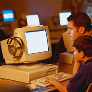 Father And Son Using Computer